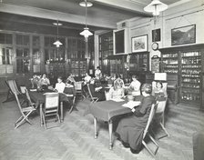 Students in the Social Hall, Ackmar Road Evening Institute for Women, London, 1914. Artist: Unknown.