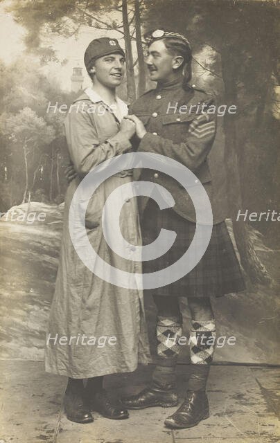 Two soldiers playing in a military concert party embrace: one is in drag and the ..., [1910-1919]. Creator: Unknown.