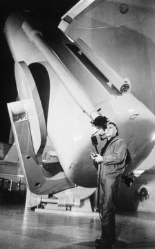 Edwin Powell Hubble (1899-1953), American astronomer, in the obsevatory. Artist: Unknown