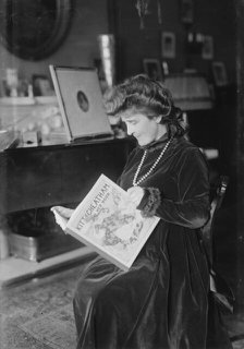 Kitty Cheatham [with her book], 1916. Creator: Bain News Service.