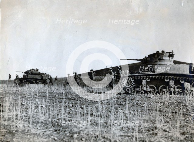 British troops supported by American tanks advance on the Tunisian front, December 1942. Artist: Unknown