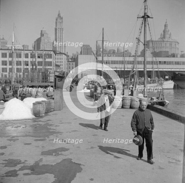 Possibly: Barrels of fish on the docks at Fulton fish market ready to be shipped..., New York, 1943. Creator: Gordon Parks.