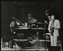 John Horler, Tony Kinsey, Alec Dankworth and John Dankworth performing in London, 1985. Artist: Denis Williams