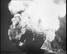 The German Airship, the Hindenburg, its Rear Half Destroyed And Obscured By Smoke With..., 1937. Creator: British Pathe Ltd.