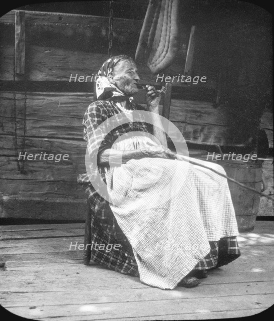 Old woman smoking a pipe, Appalachia, USA, c1917. Artist: Cecil Sharp