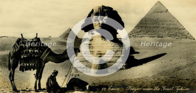 'Cairo - Prayer near the Great Sphinx', c1918-c1939. Creator: Unknown.