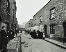 People outside boarded-up houses in Ainstey Street, Bermondsey, London, 1903. Artist: Unknown.