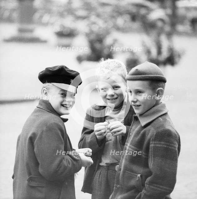 Three mischievous boys playing with fulminating powder, Landskrona, Sweden. Artist: Unknown