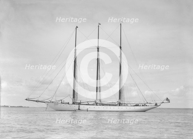 The American three mast schooner 'Karina' at anchor, 1912. Creator: Kirk & Sons of Cowes.