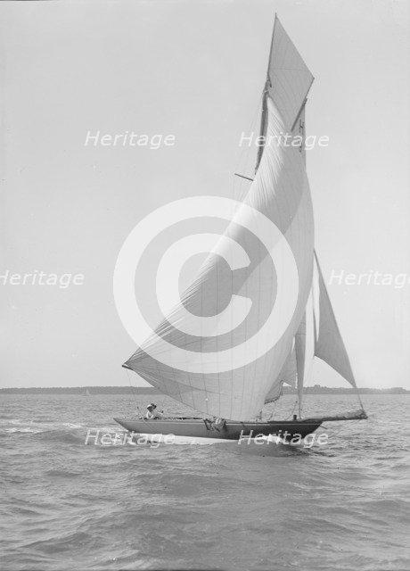 The 8 Metre 'Termagent' (H9) sailing downwind in fine weather, 1911. Creator: Kirk & Sons of Cowes.