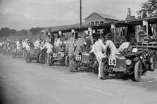 Triumph and Riley cars in the pits at the RAC TT Race, Ards Circuit, Belfast, 1929 Artist: Bill Brunell.