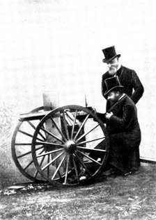The Prince of Wales firing a Maxim Gun: Mr. Maxim standing by, 1898. Creator: Russell & Sons.