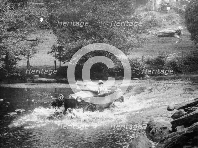 A Lancia Lambda being driven through water, c1925. Artist: Unknown