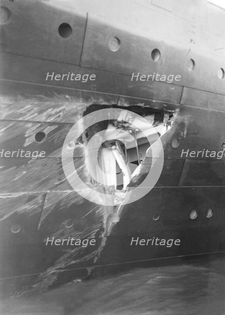 Hole torn in the hull of 'RMS Olympic' after the collision with 'HMS Hawke' in the Solent, 1911. Creator: Kirk & Sons of Cowes.