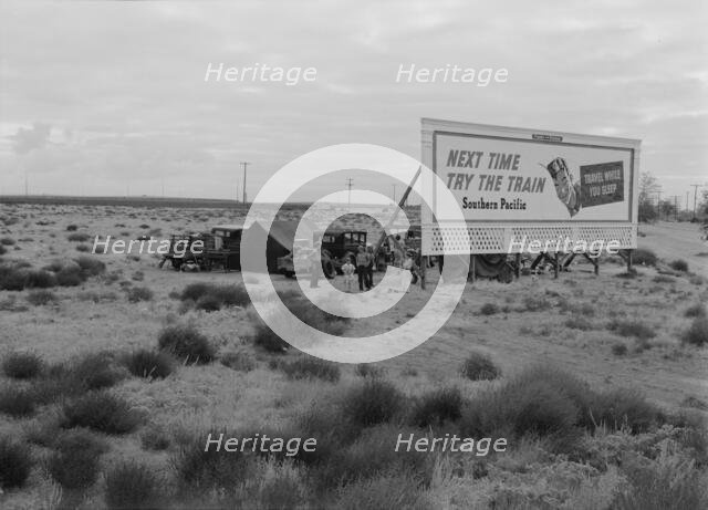 Three families camped on the plains along US99 in California, 1938. Creator: Dorothea Lange.