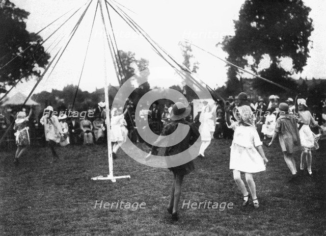 Children dancing round a maypole, 1926. Artist: Unknown