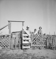Family from Oklahoma, Highway City, near Fresno, California, 1939. Creator: Dorothea Lange.