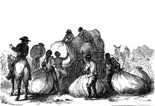 Negro labour loading sacks of cotton on cart, Southern states of USA. Artist: Unknown