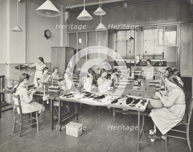 Hair dressing class, Barrett Street Trade School for Girls, London, 1915. Artist: Unknown.