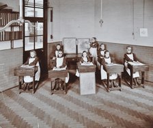 Geography lesson at Elm Lodge Residential School for Elder Blind Girls, London, 1908. Artist: Unknown.