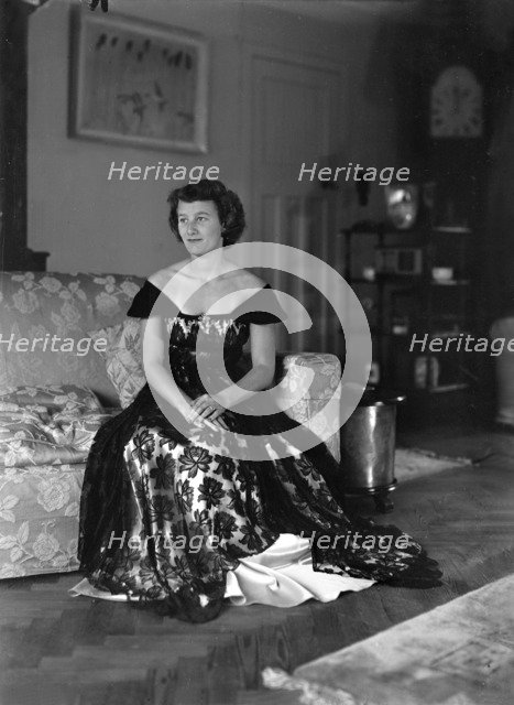 Portrait of seated woman in evening dress, (Isle of Wight?), c1935.  Creator: Kirk & Sons of Cowes.