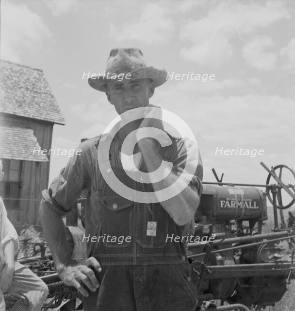 Former tenant farmer on a large cotton farm, now a tractor driver, Bell County, Texas, 1937. Creator: Dorothea Lange.