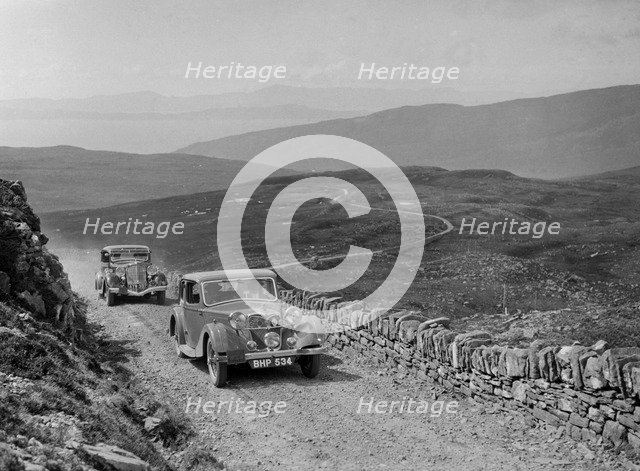 Riley of Miss F Walker leading a Hudson Eight at the RSAC Scottish Rally, 1936. Artist: Bill Brunell.