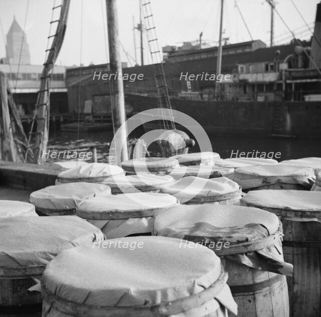 Barrels of fish on the docks at the Fulton fish market ready to be shipped to..., New York, 1943. Creator: Gordon Parks.