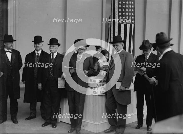 Thomas Riley Marshall, John Austin Moon, Champ Clark Buying War Savings And Thrift Stamps, 1918. Creator: Harris & Ewing.