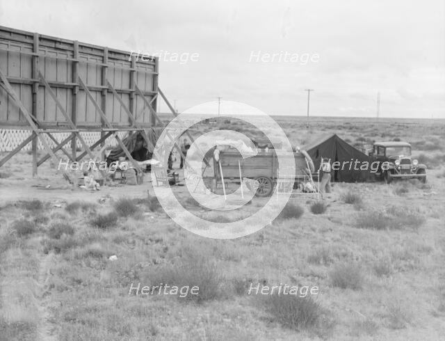 Billboard along U.S. 99...three destitute families...Kern County, CA, 1938. Creator: Dorothea Lange.