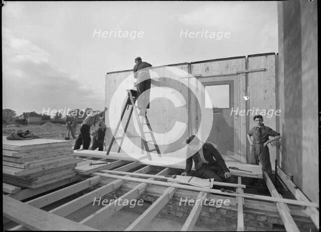 Workmen assembling a Swedish prefabricated house, 1945. Creator: Ministry of Works.