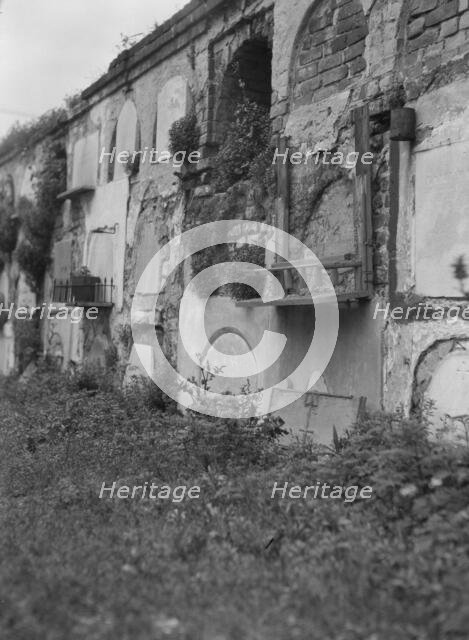 Wall tombs of the old St. Louis Cemetery, New Orleans, between 1920 and 1926. Creator: Arnold Genthe.