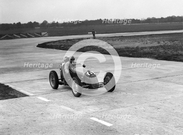 Austin 7 twin cam racing single seater on the Campbell Circuit, Brooklands. Artist: Bill Brunell.
