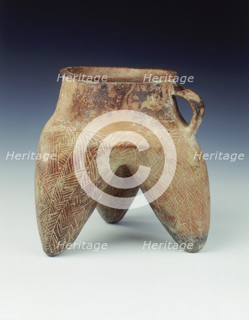 Tripod jar with strap handle and hollow legs, Qijia culture, Qinghai province, China, 1800-1500 BC. Artist: Unknown