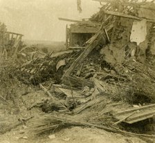 Bombed out building, body of dead soldier in foreground, 1916. Artist: Unknown.