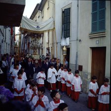 Procession of Corpus', altar boys and custody pass through the narrow streets of the town of Poll…