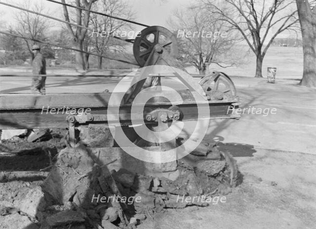 Possibly: Clearing earth and old paving for extension...at Fourteenth, Washington, D.C, 1942. Creator: Dorothea Lange.