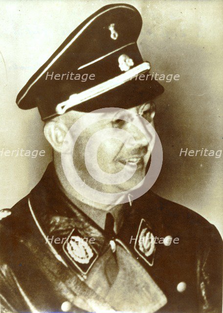 Heinrich Himmler in early SS uniform (black tie and cap) with the rank of Oberführer, 1933. Artist: Unknown