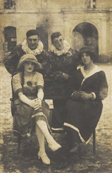 Members of 'The Stars' concert party, two soldiers in drag and two as pierrots, pose around..., 1919 Creator: Unknown.