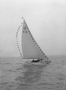 The 18-foot keelboat 'Prudence' (K2) with prize flags, 1922. Creator: Kirk & Sons of Cowes.