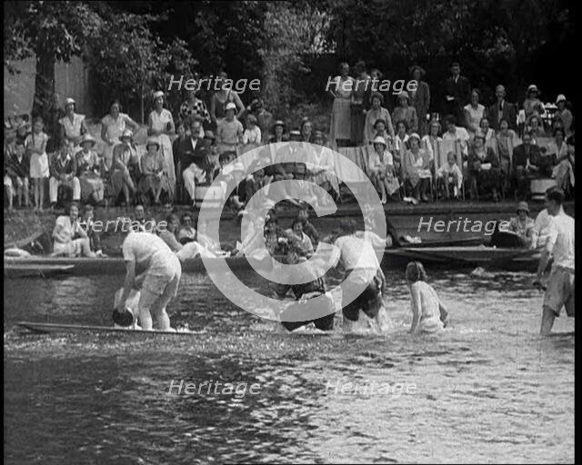 People in Sinking Rowing Boat, Watched by Crowd, 1933. Creator: British Pathe Ltd.