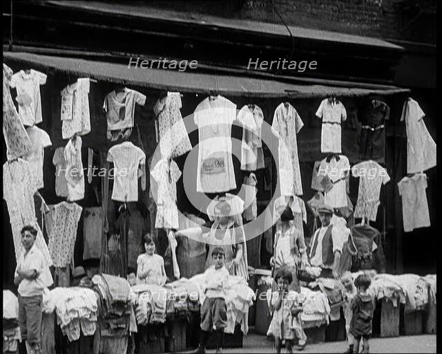 Street View of Street Market Selling Clothes in New York City, 1932. Creator: British Pathe Ltd.