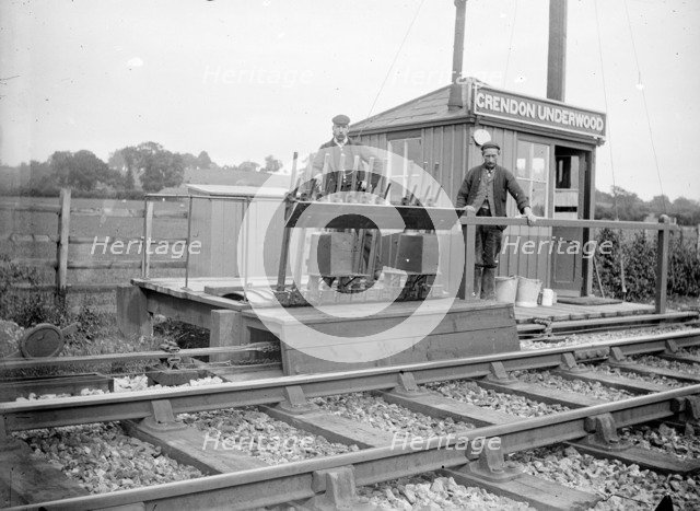 Signalmen pose outside a signal box near Grendon Underwood, Northamptonshire, c1872-c1923. Artist: Alfred Newton & Sons
