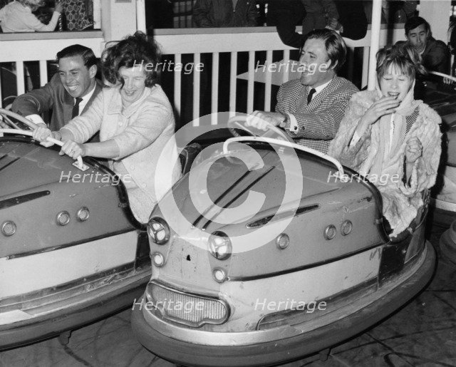 Graham Hill and Jim Clark on Dodgem cars at Butlins, Bognor Regis, 1960s. Artist: Unknown