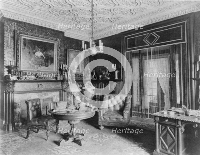 Room with plasterwork ceiling, fireplace, and circular table.., Greenwich, Connecticut, 1908. Creator: Frances Benjamin Johnston.