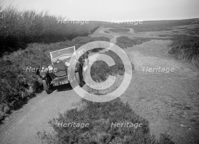 Kitty Brunell road testing a Riley 9 tourer, c1930.  Artist: Bill Brunell.