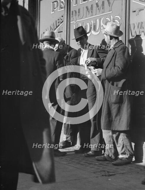 Unemployed men on Howard Street, San Francisco, California, 1937. Creator: Dorothea Lange.