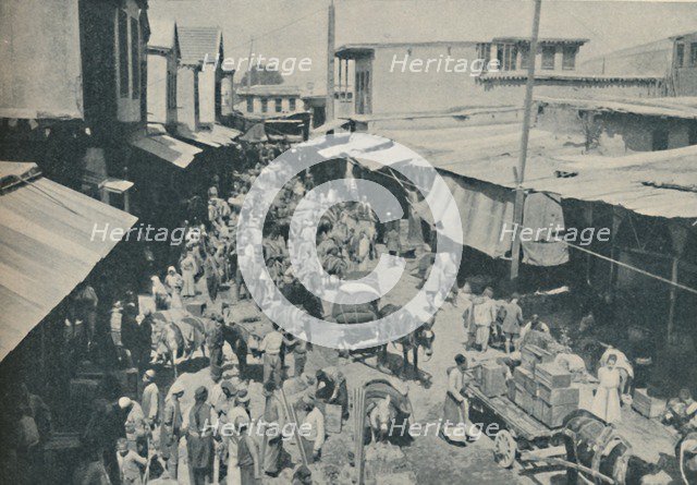 'Chaffering Oriental Crowds That Throng The Street Markets', c1935. Artist: Charles H Gabriel.