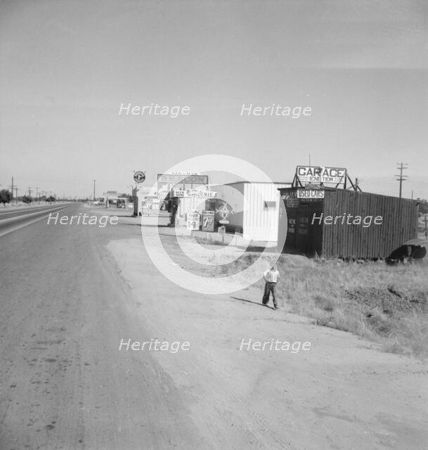 Along the highway U.S. 99 at Highway City, between Tulare and Fresno, California, 1939. Creator: Dorothea Lange.