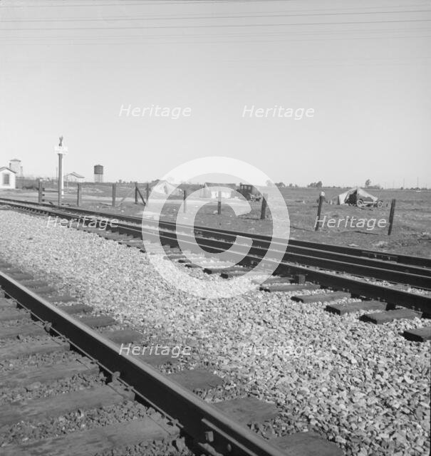 Migrants' tents...along the right of way of the Southern Pacific, near Fresno, CA, 1939. Creator: Dorothea Lange.